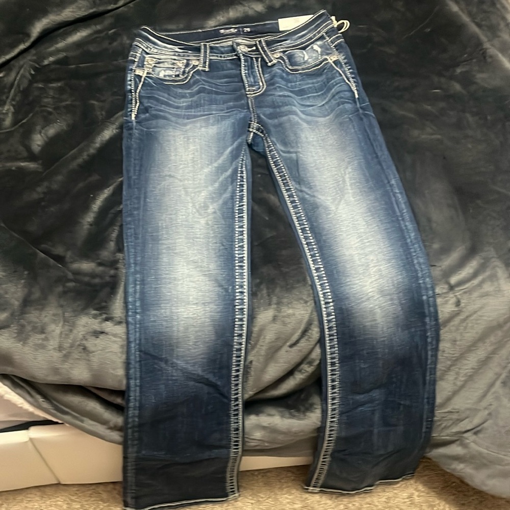 these are midrise boot cut jeans from Miss me size 26x34 unworn!!